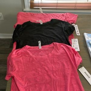3 NEW RBX Wicking Shirts- 2 pink and 1 black!   New with tags!!